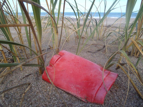 plastic-deodorant-tube-left-on-beach